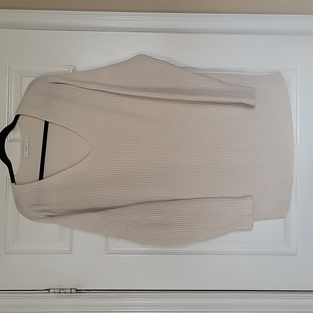 Beige V-neck oversized sweater